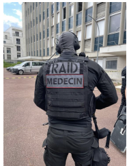 A French Police Nationale RAID Doctor during a hostage rescue exercise (RAID doctors are integrated but unarmed – note their PPE and communication equipment is the same as the tactical teams)